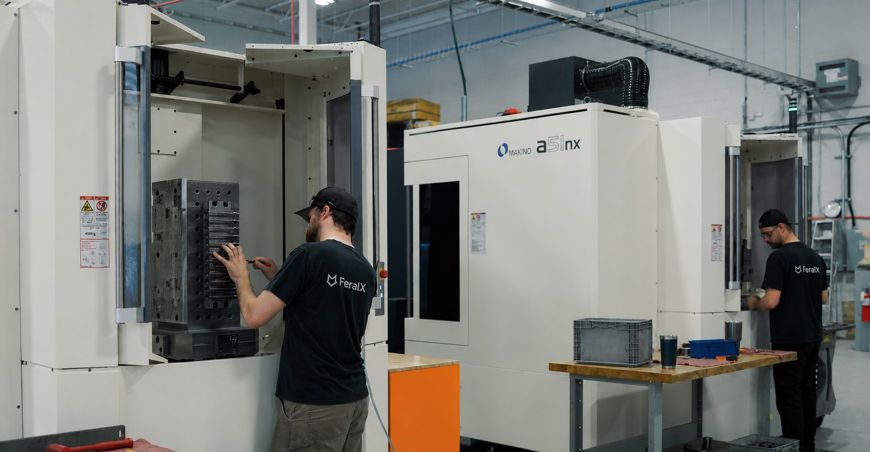 FeralX production floor — CNC machining centres running in Canada